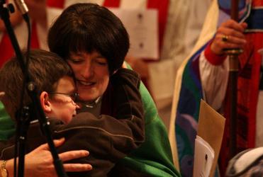 Nathan Kelly-Moore gives his newly-installed mum a squeeze of congratulations.