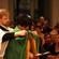 Richard Ericksen, the cathedral's master of ceremonies, places the dean's new cope around Jo's shoulders.