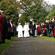 John McAlpine, Jenny's husband and co-vicar, leading the hearse, flanked by Anne Priestley and James Harrison, Jenny's son. 
