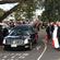 The hearse emerges from the honour guard, bound for the crematorium.