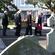 The pallbearers - with Jenny's son James at the rear - bear Jenny through the old St Peter's church graveyard to the hearse.