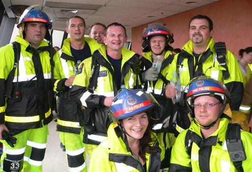 Bishop Ross and his fire police brigade team at the top of the 28 level BNZ tower