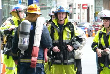 Final briefing before the firefighters begin their 549-step slog up the BNZ tower.