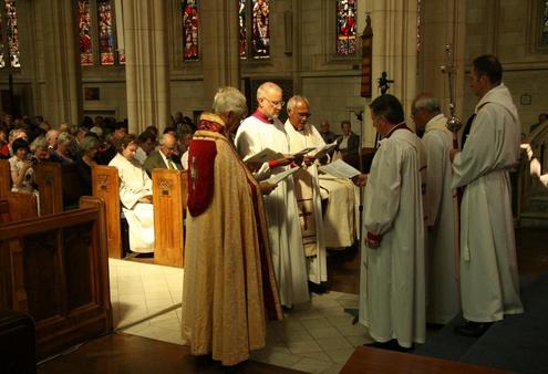 Archdeacon Graham Langley and Bishop Winston Halapua present the candidate to the Primates for their examination.