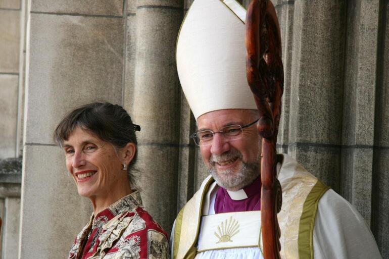 The new bishop and his wife respond to wellwishers outside the main entrance to the cathedral.