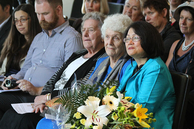 That's Archbishop David's wife, Tureiti Moxon, holding the bouquet, and his mother, Mrs Joan Moxon, beside her.