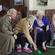 Bishop Victoria watches while a spirited game of indoor bowls is in progress.