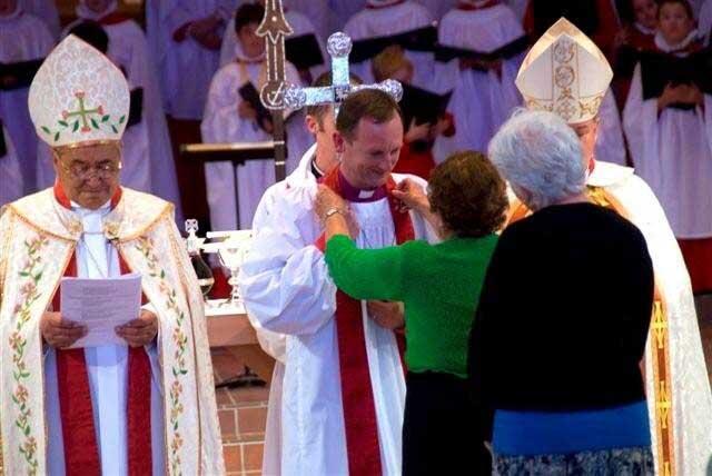 A pectoral cross is placed around the neck of Auckland's 11th bishop, Ross Bay. Picture, Simon Woolf. A pectoral cross is placed around the neck of Auckland's 11th bishop, Ross Bay. Picture, Simon Woolf.