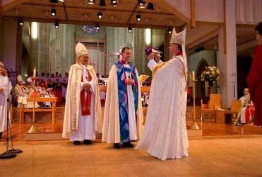 Archbishop David Moxon prepares to place the bishop's mitre on Ross Bay. Picture, Simon Woolf.