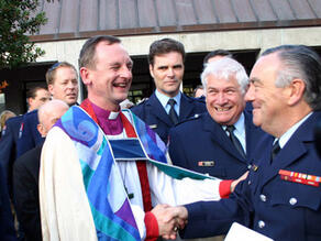 Ross Bay, the new Bishop of Auckland, with members of the Auckland Fire Police Unit. - NZPA Ross Bay, the new Bishop of Auckland, with members of the Auckland Fire Police Unit. - NZPA