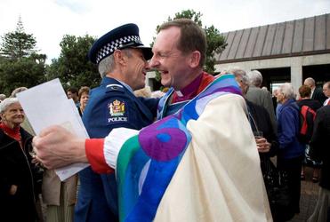 The long arm of the law – Sgt Stu Kearns from the Serious Crash Unit – catches up with Auckland's new bishop, Ross Bay. Picture, Simon Woolf.