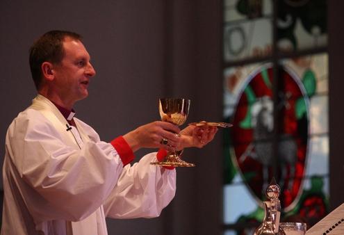 Bishop Ross Bay invites the congregation to make their Communion.