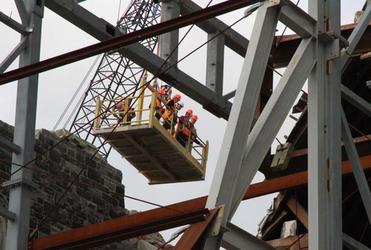 A group of our high-flying bishops peer into the ruined depths of ChristChurch Cathedral. 