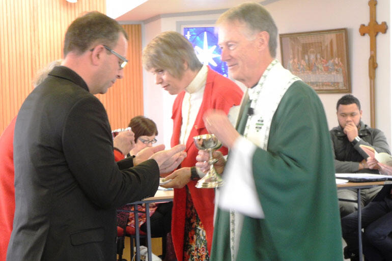 Bishop-elect Andrew Hedges, Vicar-General Brian Hamilton and Regional Dean Jenny Dawson at the Synod Eucharist.