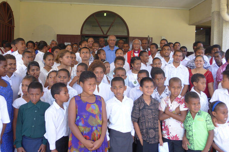 Archbishop Winston and President Epeli Nailatikau surrounded by youth who participated in the thanksgiving service.