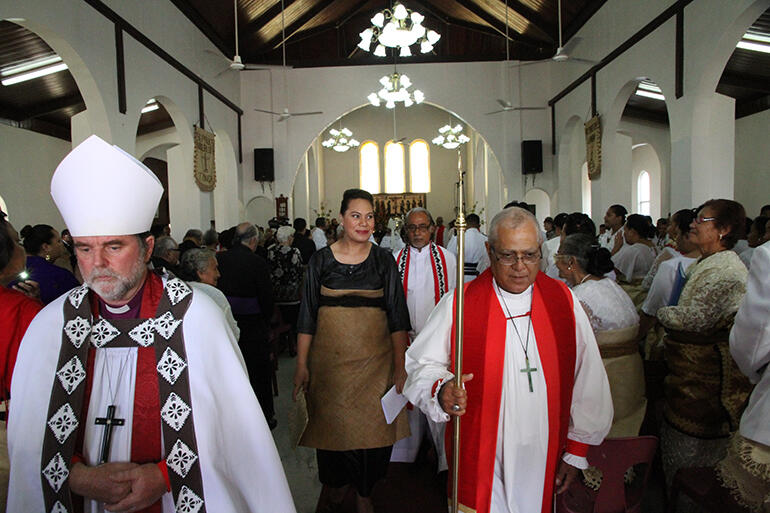 The bishops and the royal party process out of the church.