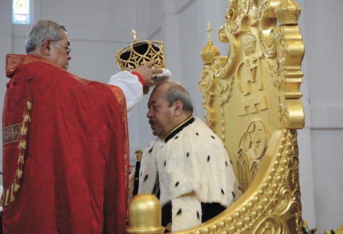 Archbishop Jabez places the crown on Tonga's new King.