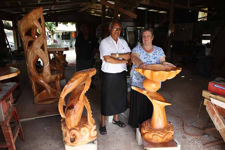 The Rev Sue Halapua standing behind the new baptismal font at the workshop where the altar furniture was sanded and varnished.