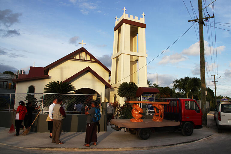 The truck bearing the new altar pulled up outside the church on Friday evening.