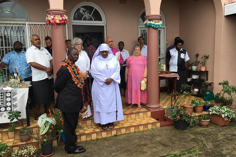 Diocese of Polynesia hosts gather for prayer on the steps of Archbishop Winston's home as they welcome delegates to a Sunday feast. Diocese of Polynesia hosts gather for prayer on the steps of Archbishop Winston's home as they welcome delegates to a Sunday feast.