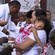 Mum makes her communion - while her daughter is dead to the world, alive to Christ.