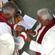 Archdeacon Schwalger places the episcopal ring on Bishop Winston's finger.