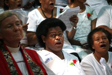 Bishop Victoria meditates as the Cathedral choir sings.