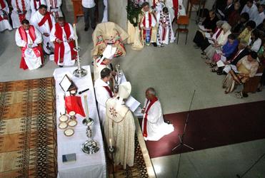 Bishop Winston recites his vows of commitment before the archbishops and the congregation.
