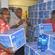 DoP staff Tome Enikosuna (left), Sione Makisiale and Mesake Saneger stack water at the Tuvalu High Commission in Suva.