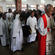 Bishop Winston Halapua leads the pallbearing priests from the cathedral.