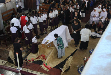 High school children were among the hundreds to file past the Archbishop's casket while he lay in state.