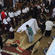 High school children were among the hundreds to file past the Archbishop's casket while he lay in state.