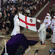 The diocesan flag about to be draped across the casket.