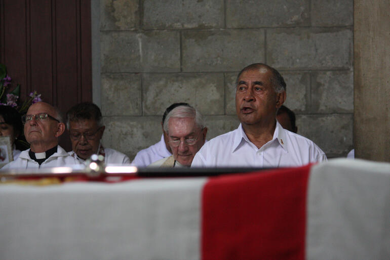 The President of Fiji, Ratu Epeli Nailatikau, seen across the Bishop's crozier, which lay on his casket.