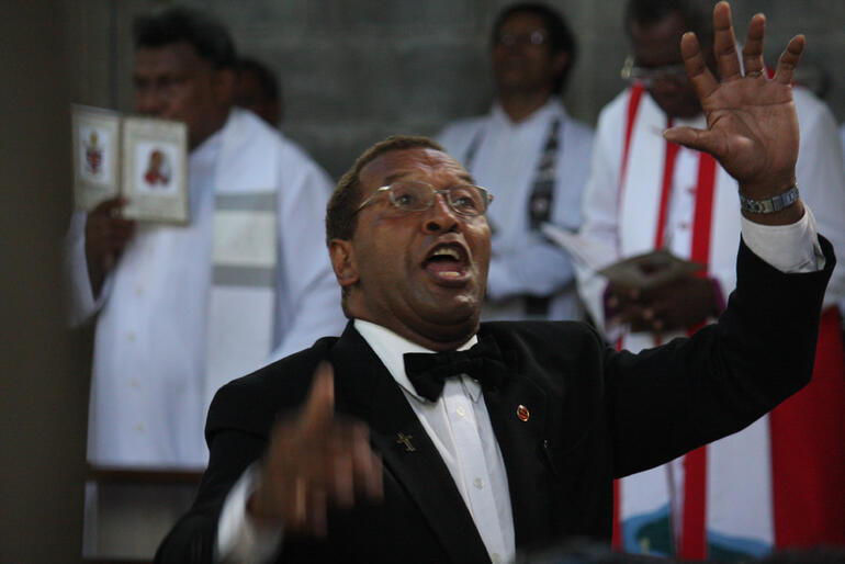 The Rev Tomu Asioli, choirmaster.