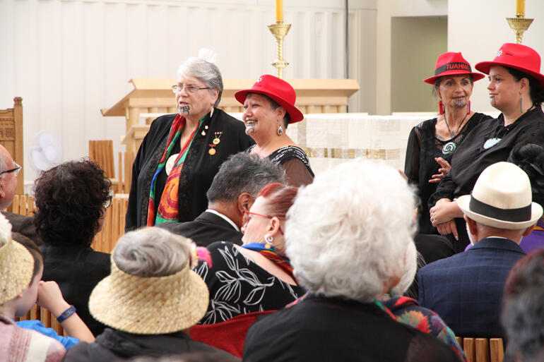 Rev Jane de Feu (left) readies to call Bishop Richard and his whānau into the Cathedral.