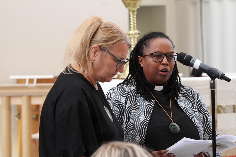 Teresa Kundycki-Carrell and Rev Watiri Maina lead the prayers of the people.