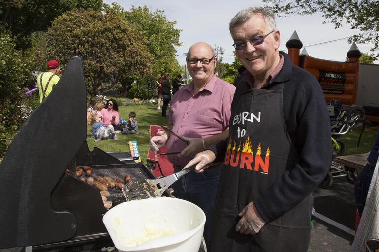 Parishioners fire up the BBQ for All Souls' family-fun opening day