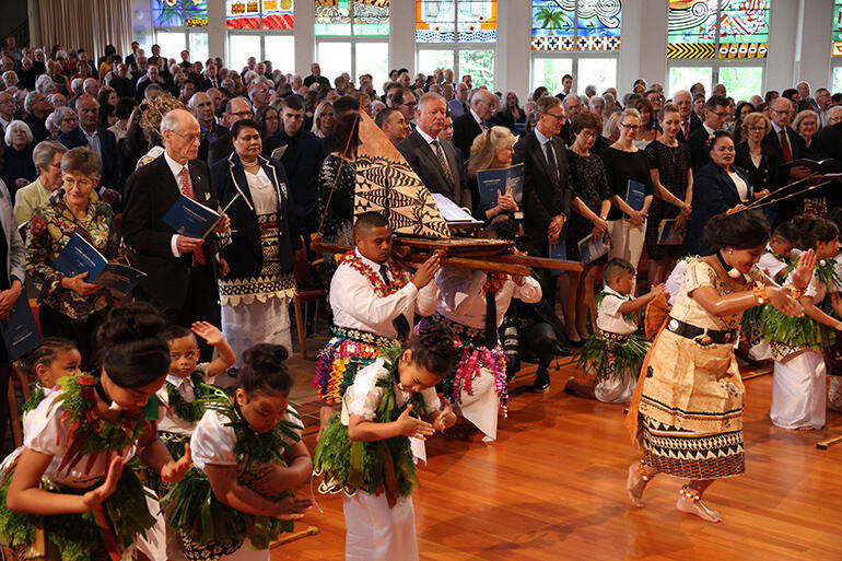 The gospel vaka arrives at the front of the cathedral.