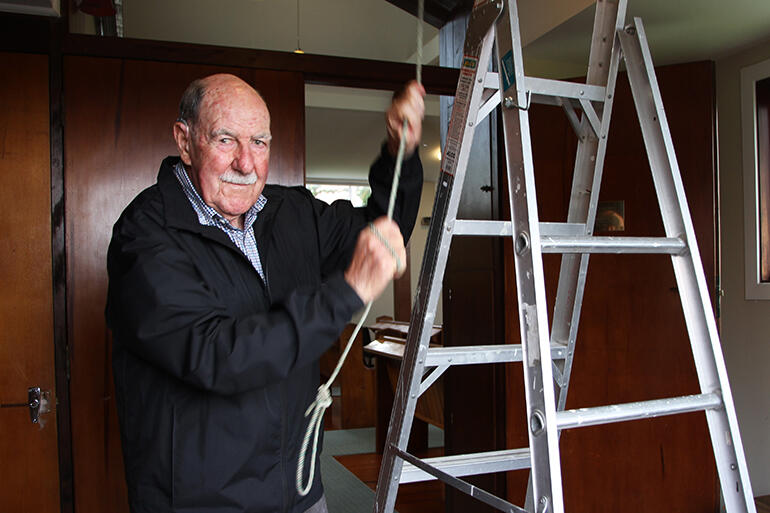 Frank Bartley, the man who reconnected the rope, has just threaded it back down through the foyer ceiling. Frank Bartley, the man who reconnected the rope, has just threaded it back down through the foyer ceiling.