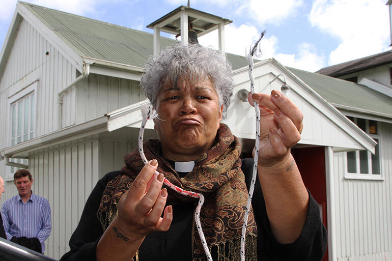 Mock dismay - Jacynthia with the frayed ends of the old bell rope. Mock dismay - Jacynthia with the frayed ends of the old bell rope.