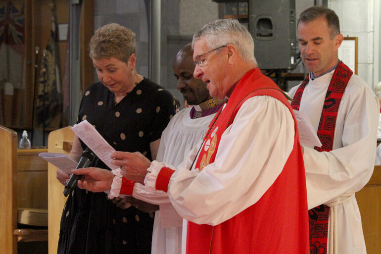 Jenny Dickie, Rev Simon Martin and Bishop Richard Ellena present Rev Steve Maina to be ordained bishop.