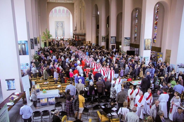 Clergy file out of the diocesan service of thanksgiving after the ordinations. Clergy file out of the diocesan service of thanksgiving after the ordinations.