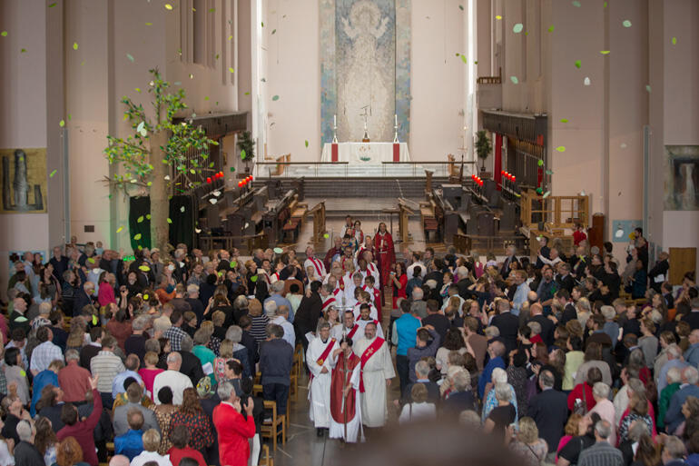 Newly ordained at Wellington Cathedral depart as leaves from the 'tree of life' shower prayers over the congregation. Photo: John Setter Newly ordained at Wellington Cathedral depart as leaves from the 'tree of life' shower prayers over the congregation. Photo: John Setter