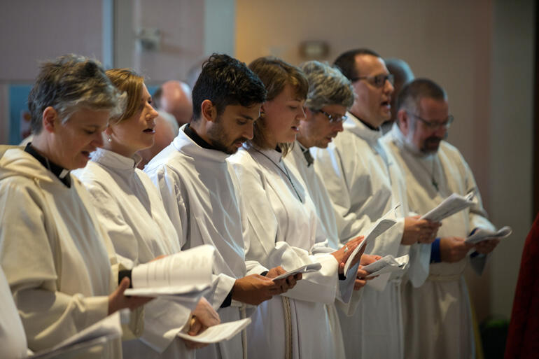 Ordinands line up to begin their solemn vows. Photo: John Setter Ordinands line up to begin their solemn vows. Photo: John Setter