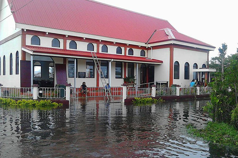 All Saints, Fasi. The floor is millimetres above the flood waters. Pic by Malu Elone. All Saints, Fasi. The floor is millimetres above the flood waters. Pic by Malu Elone.