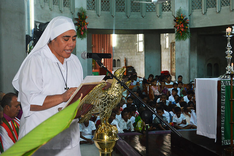 Sr Kalo, from St Christopher's Home, Naulu, reads the gospel. Sr Kalo, from St Christopher's Home, Naulu, reads the gospel.