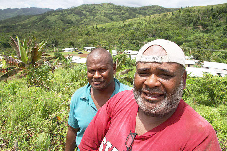 Village builder: carpenter Harold Koi and deacon-to-be Waisea Bogi. Village builder: carpenter Harold Koi and deacon-to-be Waisea Bogi.