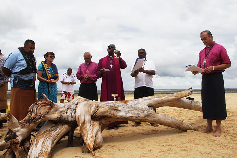 Archbishop Josiah invites all the onlookers to receive Communion. Archbishop Josiah invites all the onlookers to receive Communion.