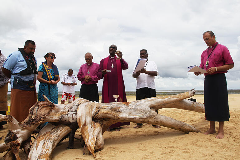 Archbishop Josiah invites all the onlookers to receive Communion.